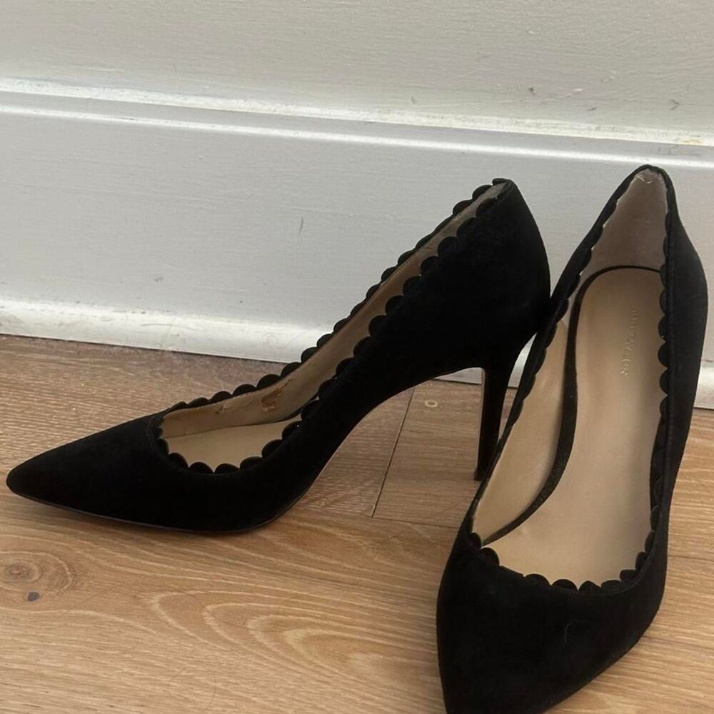 Black suede pointed toe heels